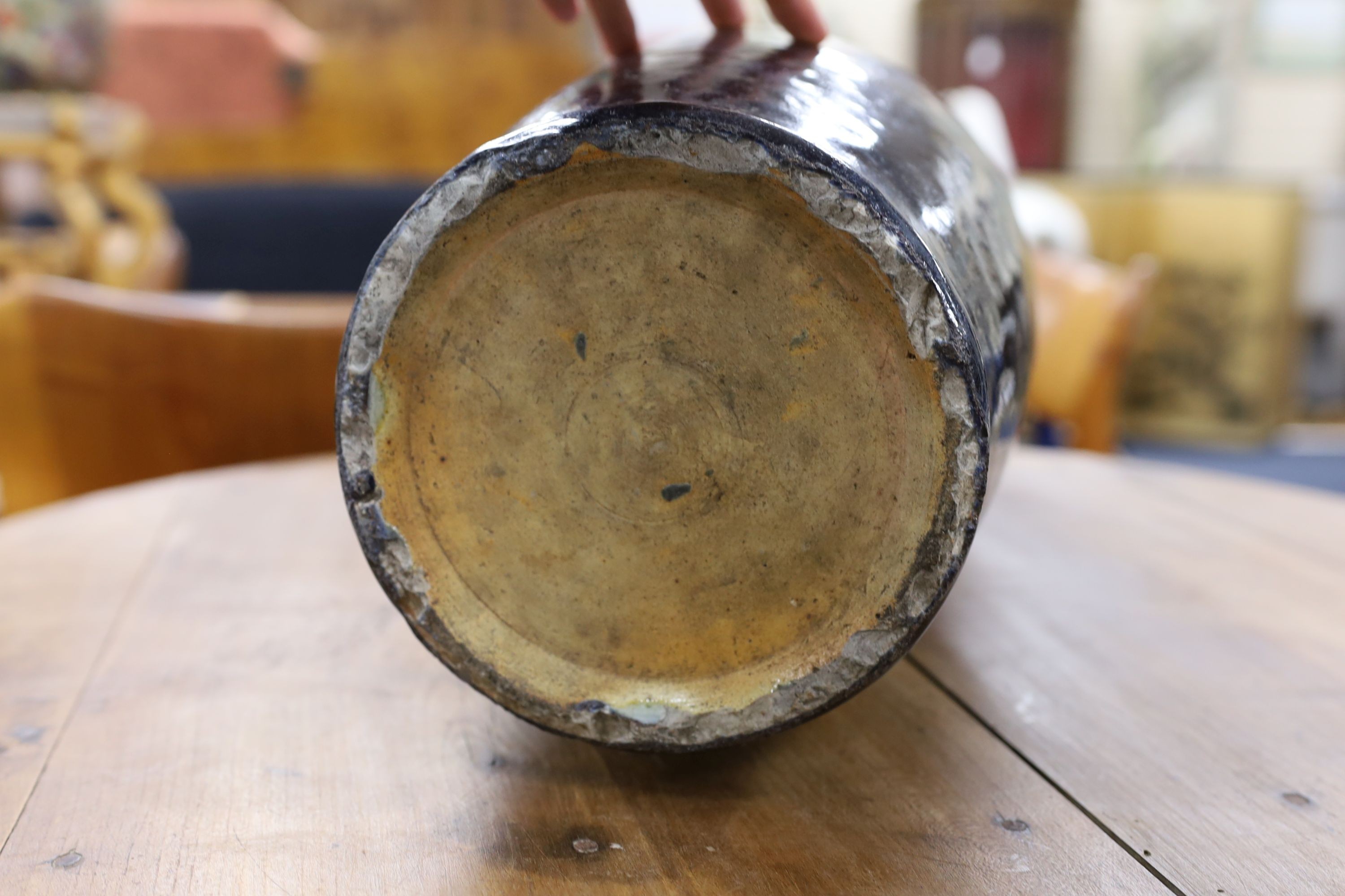 A large Chinese sang de boeuf glazed vase on carved wooden stand., Vase 61 cms high not including stand.